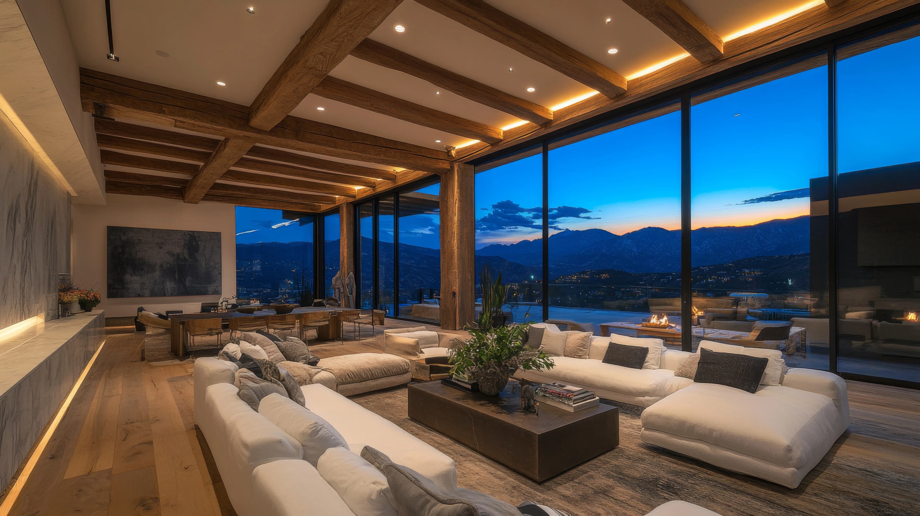 Mountain-view living room glowing at dusk